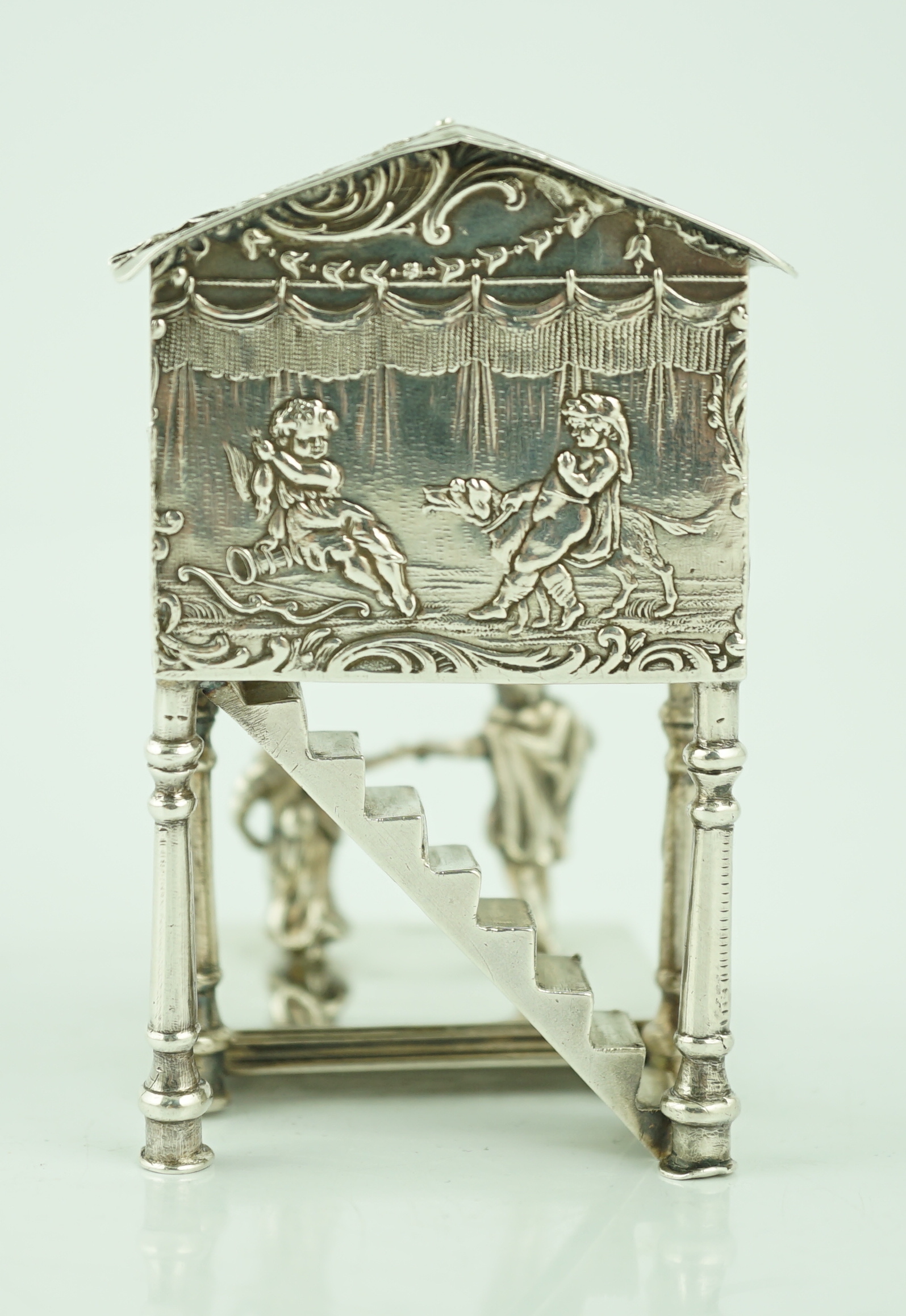 A late 19th century German silver miniature figural group, modelled as two dancers, with three musicians in a band stand, import marks for John George Smith